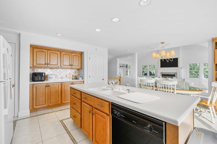 Harwich Cape Cod vacation rental - Fully equipped kitchen looking into dining area and living room