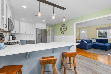Eastham Cape Cod vacation rental - Modern kitchen with island seating for casual dining
