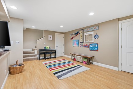 Eastham Cape Cod vacation rental - Staircase leading to the lower-level living and recreation area