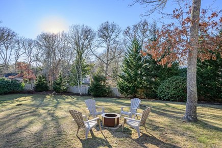 Harwich Cape Cod vacation rental - Fire pit in the backyard