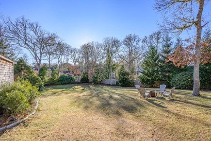 Harwich Cape Cod vacation rental - backyard with firepit