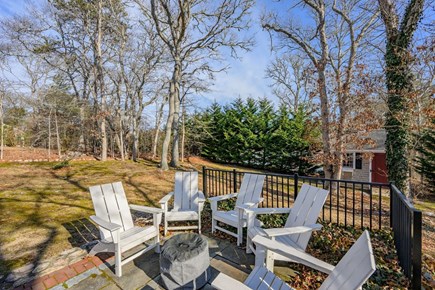 Harwich Cape Cod vacation rental - Adirondack chairs and wood burning fire pit