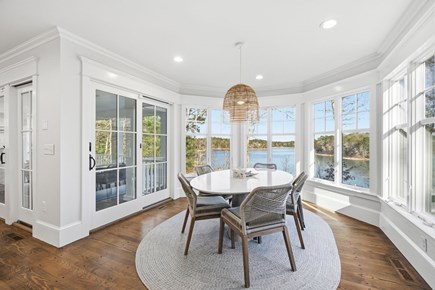 Sandwich Cape Cod vacation rental - Bright dining area with beautiful pond scenery and direct access to the deck