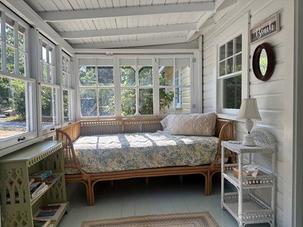 Eastham, Steps from Cooks Brook Beach  Cape Cod vacation rental - Daybed in sunroom with garden views.
