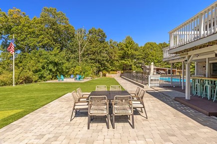 Falmouth Cape Cod vacation rental - Outdoor dining with views of pool, bar, and water