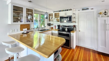 Wellfleet Cape Cod vacation rental - Nicely equipped kitchen w/ stainless appliances & counter seating
