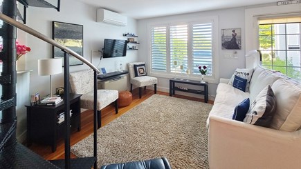Wellfleet Cape Cod vacation rental - Living room has a spiral staircase to the second floor bedroom