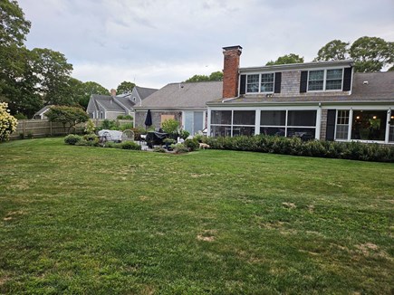 Chatham Cape Cod vacation rental - View of patio and screened porch from the backyard