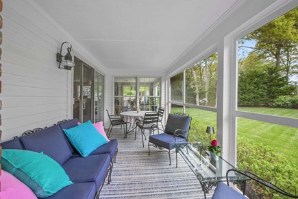 Chatham Cape Cod vacation rental - Screened porch with seating and dining area
