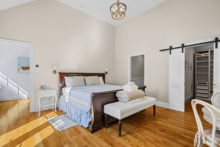 Harwich Port Cape Cod vacation rental - Primary bedroom (#2) with King sized bed and vaulted ceilings.