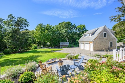 Harwich Port Cape Cod vacation rental - Patio with views of driveway and the basketball court.