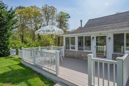 Harwich Port Cape Cod vacation rental - Exterior view of the Cottage deck withing dining area
