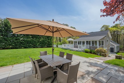 Harwich Port Cape Cod vacation rental - Patio off of the Main House with outdoor dining area