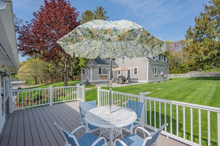 Harwich Port Cape Cod vacation rental - Exterior view of the Cottage deck with dining area