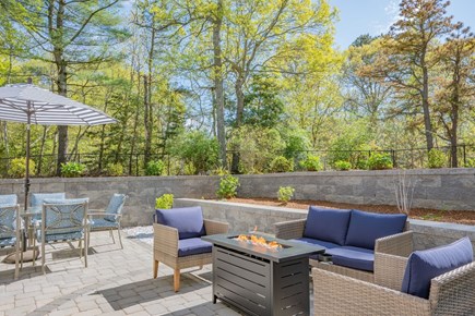Sandwich Cape Cod vacation rental - Outdoor patio with fire pit and bar area