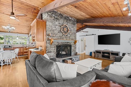 Sandwich Cape Cod vacation rental - Spacious living room with fireplace (not for guest use) looking into the kitchen
