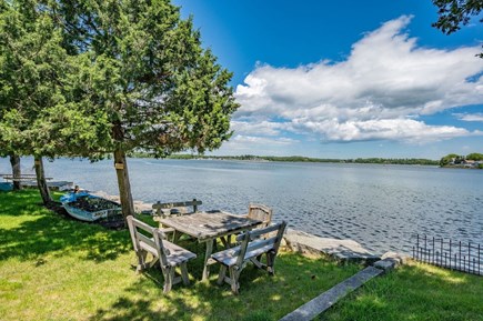 Bourne, Buzzards Bay Cape Cod vacation rental - Outside table with view of Buttermilk Bay