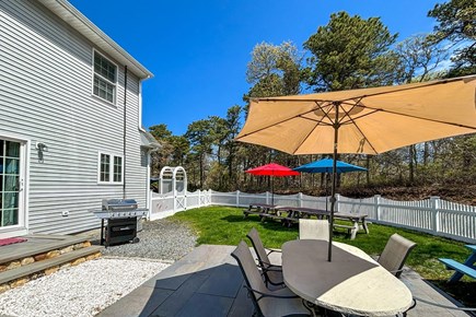 Chatham, Tres Gallos Cape Cod vacation rental - Fenced backyard hangout: grill, patio dining & room for everyone