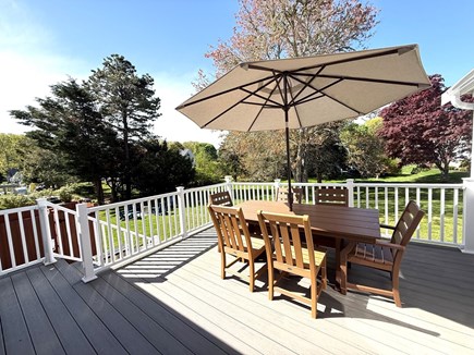Dennis Village Cape Cod vacation rental - Deck w/ polywood dining set + umbrella, grill at bottom of stairs