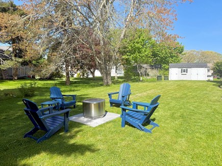 Dennis Village Cape Cod vacation rental - Backyard solo stove fire pit with Adirondack chairs