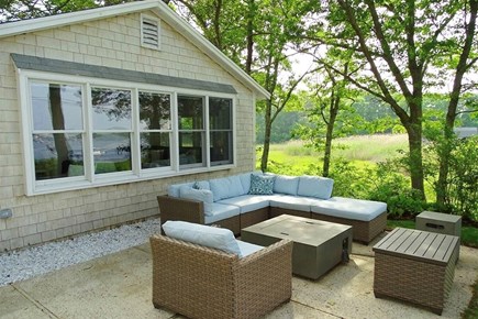 West Dennis Cape Cod vacation rental - Outside front patio area with fire pit