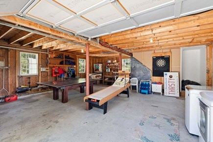 West Dennis Cape Cod vacation rental - Garage game and laundry area