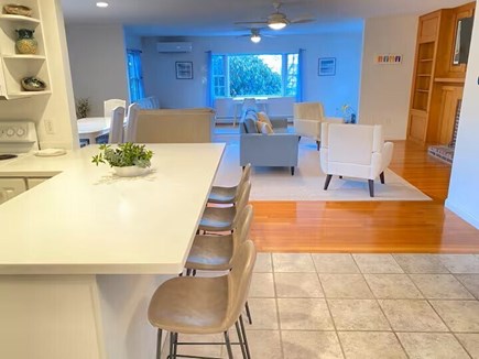 South Yarmouth Cape Cod vacation rental - Open concept kitchen and living area includes dining table.