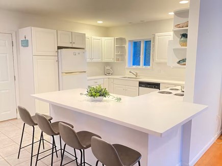 South Yarmouth Cape Cod vacation rental - Full kitchen with counter stools, includes electric range/oven.