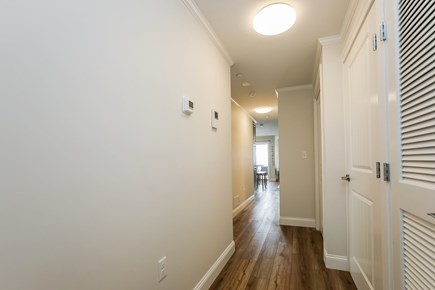 Dennis Port Cape Cod vacation rental - Hallway with stackable washer dryer in the closet - 405 Old Wharf Road-Dennisport Cape Cod- New England Vacation Rentals