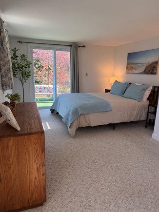 Eastham, Sand Dollar Cape Cod vacation rental - Queen bedroom with slider access to the backyard