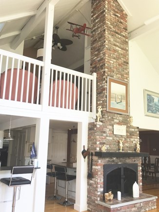 New Seabury Cape Cod vacation rental - 22’ high Great Room with large fireplace overlooked by loft.