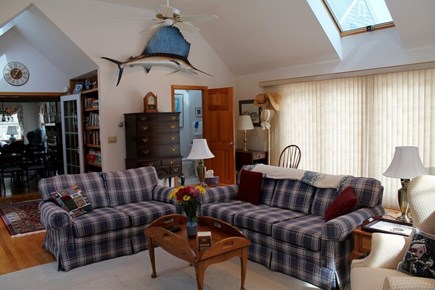 Eastham Cape Cod vacation rental - Family room with powder room and laundry.