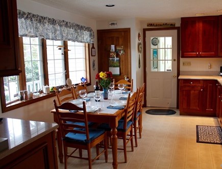 Eastham Cape Cod vacation rental - Open airy kitchen looking out onto a farmer's porch.