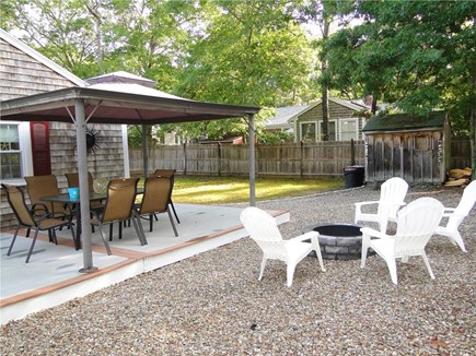 South Dennis Cape Cod vacation rental - Great side yard with covered deck area and fire pit