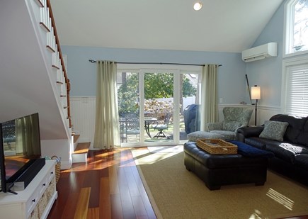 Brewster, Ocean Edge Resort Cape Cod vacation rental - Living room opens to back patio with grill, table