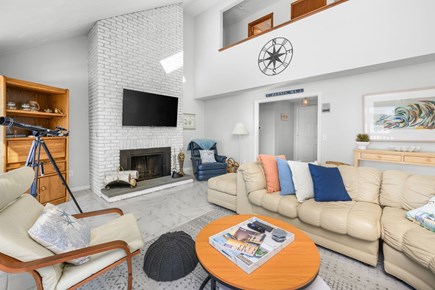 West Dennis Cape Cod vacation rental - Bright and comfortable living room featuring a spacious sectional sofa and TV