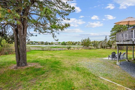 West Dennis Cape Cod vacation rental - Large backyard running into Bass River