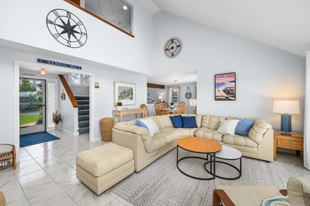West Dennis Cape Cod vacation rental - Bright and comfortable living room featuring a spacious sectional sofa and TV