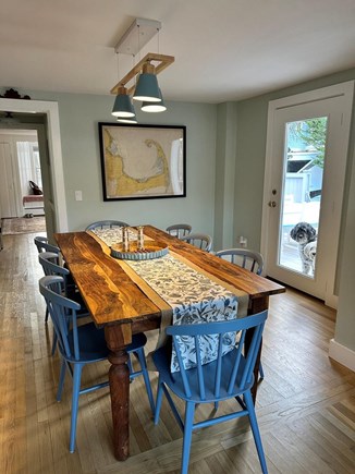 Hyannisport Cape Cod vacation rental - Inside dining room & access to porch with BBQ, table, & fire pit.