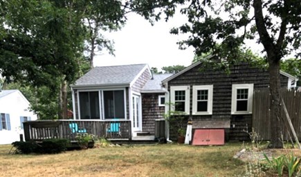 West Harwich Cape Cod vacation rental - Back yard, deck with gas grille, outside shower