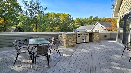 West Falmouth Cape Cod vacation rental - Large deck with outdoor table and gas grill