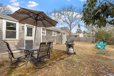 Yarmouth Cape Cod vacation rental - This patio and classic Adirondack chairs invites you!