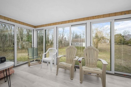Barnstable Cape Cod vacation rental - Screened in porch with views of the backyard