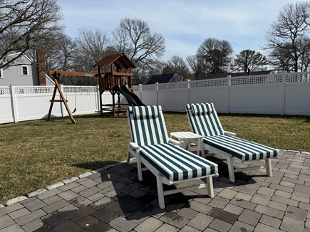 Centerville, West Hyannisport Cape Cod vacation rental - Fenced in backyard and patio with dining table, grill, loungers