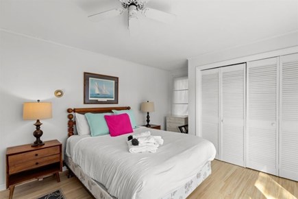 Wellfleet, Marshside Escape Cape Cod vacation rental - Cozy queen bedroom with clothing storage and soft light