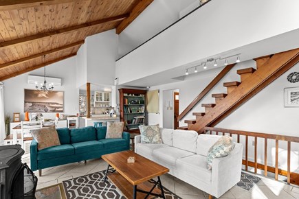 Wellfleet, Marshside Escape Cape Cod vacation rental - Spacious great room with loft, dining area, and wood stove