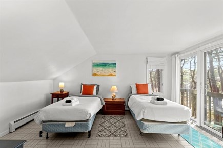 Wellfleet, Marshside Escape Cape Cod vacation rental - Loft bedroom with two twin beds and treetop light