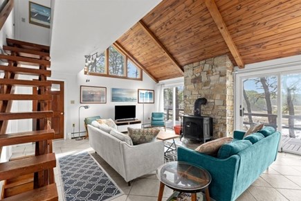Wellfleet, Marshside Escape Cape Cod vacation rental - Open living room with wood burning stove for cool evenings