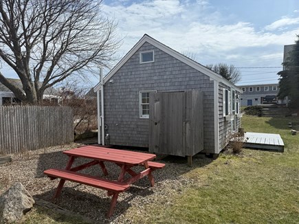 Wellfleet, Harborside Cottage Cape Cod vacation rental - Side view with picnic area and outdoor shower