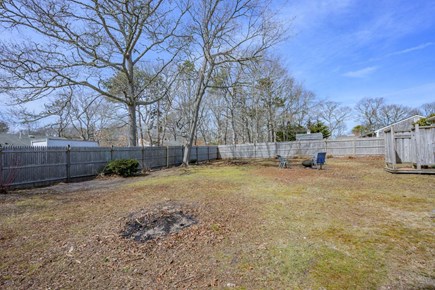 South Yarmouth Cape Cod vacation rental - A fully fenced backyard offering privacy and a safe